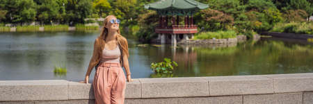 Woman tourist in  Korean palace grounds in Seoul, South Korea.