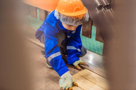 Boy plays in a children's construction site.