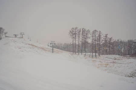 Ski lift chairs on bright winter dayの写真素材