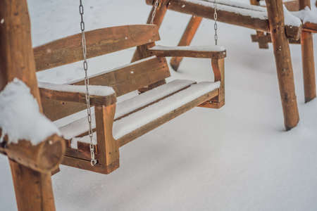 Benches in the winter city park which has been filled up with snow.の写真素材