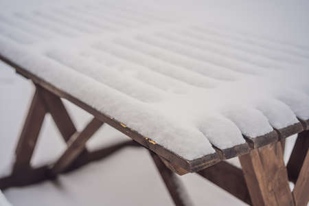 Benches in the winter city park which has been filled up with snow.の写真素材