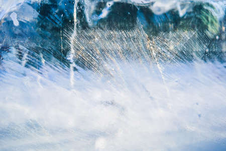 Blue ice surface with scratches. Abstract background of ice structure.の写真素材