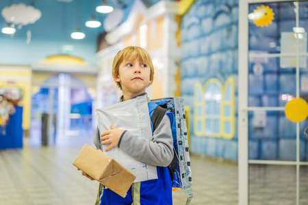 The boy plays that he is a postmanの写真素材