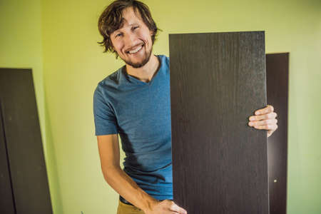 Frustrated Man Putting Together Self Assembly Furnitureの写真素材