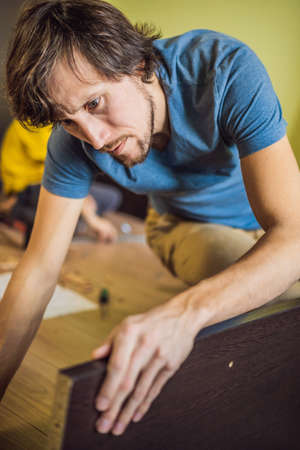 Frustrated Man Putting Together Self Assembly Furnitureの写真素材
