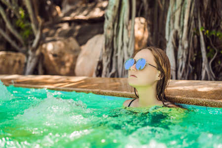 Portrait of beautiful woman in hot tub spaの写真素材