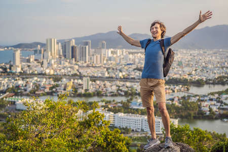 Man tourist on the background of Nha Trang city. Travel to Vietnam Conceptの写真素材