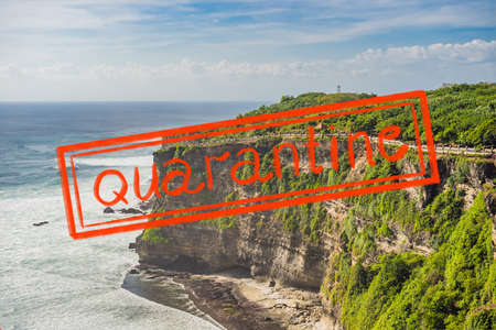 Quarantine due to coronavirus epidemic covid19 Pura Luhur Uluwatu temple, Bali, Indonesia. Amazing landscape - cliff with blue sky and seaの写真素材