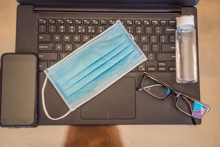 Coronavirus. Working from home wearing protective mask. quarantine for coronavirus wearing protective mask. Working from homeの写真素材