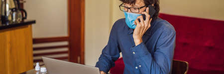 Coronavirus. Man working from home wearing protective mask. quarantine for coronavirus wearing...