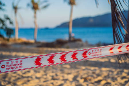 Corona Virus threat closes beaches and public places in many countries. The inscription NOT ALLOWED AREA in English, Vietnameseの写真素材