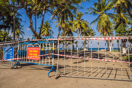 Corona Virus threat closes beaches and public places in many countries. The inscription PREVENTION OF INFECTIOUS INJURY COVID19. TEMPORARY CLOSING OF BEACHES FOR 15 DAYS STARTING FROM 1.04.2020 in Vietnameseの写真素材