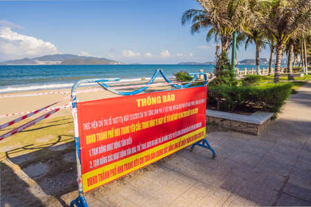 Corona Virus threat closes beaches and public places in many countries. The inscription PREVENTION OF INFECTIOUS INJURY COVID19. TEMPORARY CLOSING OF BEACHES FOR 15 DAYS STARTING FROM 1.04.2020 in Vietnameseの写真素材