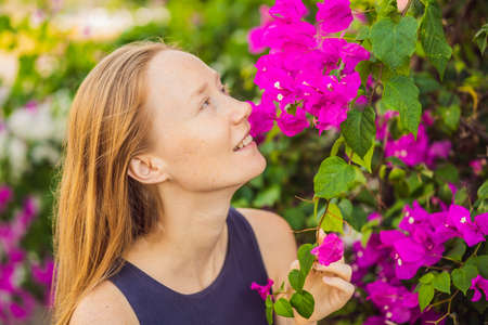 I love my skin. A young woman with freckles, moles, scars and facial wrinkles loves her skin, enjoys...