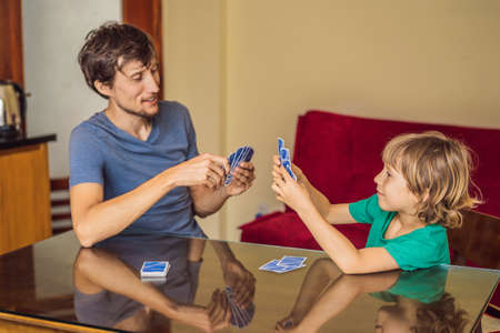 Happy Family Playing Board Game At Homeの写真素材