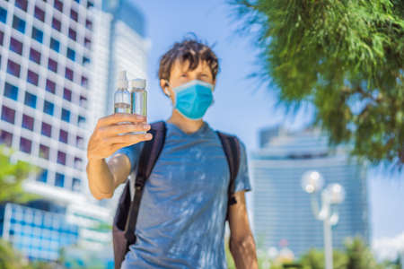 COVID-19 Pandemic Coronavirus, man hands using wash hand sanitizer gel dispenser, against Novel coronavirus 2019-nCoVの写真素材