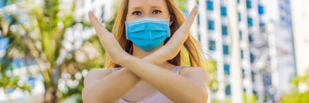 Stop quarantine so as not to kill the business and the economy OR Quarantine to stop corona virus epidemic. Keep social distancing and stay at homeの写真素材