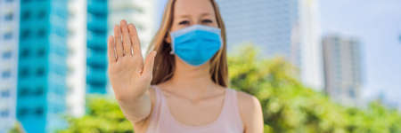 Stop quarantine so as not to kill the business and the economy OR Quarantine to stop coronavirus epidemic. Keep social distancing and stay at homeの写真素材