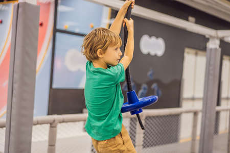 The boy has fun in an indoor playground