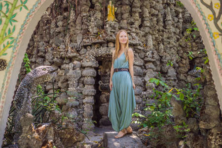 Woman tourist in Chua Tu Van temple made of shells and corals or the dragon maze. Travel to Vietnam...