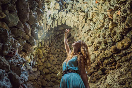 Woman tourist in Chua Tu Van temple made of shells and corals or the dragon maze. Travel to Vietnam...