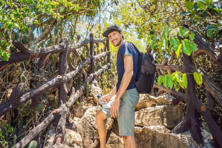 Man tourist on the background of Beautiful Marble mountains and Da Nang, Vietnam