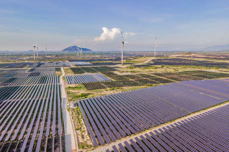 solar energy panels and wind turbine. Drone view