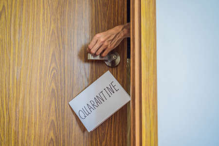Coronavirus covid-19 quarantine sign at Front door, quarantine sign at homeの写真素材