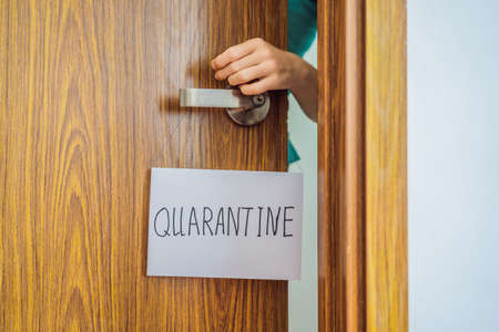 Coronavirus covid-19 quarantine sign at Front door, quarantine sign at homeの写真素材