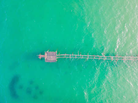 Turquoise water and concrete jetty pier, drone shotの写真素材