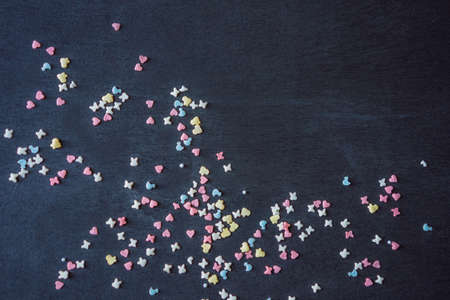 Colorful sweet background with colorful sprinkles. Holiday treat. Cupcake and Ice cream topping....