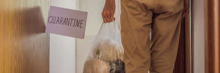 BANNER, LONG FORMAT Home delivery food during virus outbreak, coronavirus panic and pandemics. Stay safe Coronavirus covid-19 quarantine sign at Front door, quarantine sign at homeの写真素材