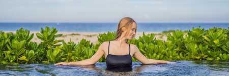 Woman relaxing in infinity swimming pool looking at view BANNER, LONG FORMAT