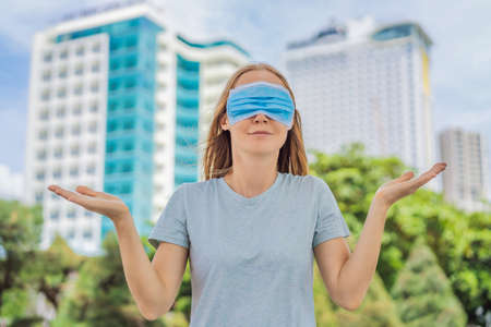 Improper wearing of mask concept. Woman wearing mask wrongの写真素材