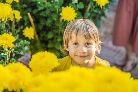 Caucasian tourist boy in Tet holidays. Vietnam Chinese Lunar New Year in springtimeの写真素材