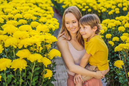 Caucasian tourists mother and son in Tet holidays. Vietnam Chinese Lunar New Year in springtimeの写真素材