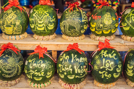 Water melons with festive engraving on Tet Eve. Tet is Lunar New Year and celebrated during four days in Vietnamの写真素材