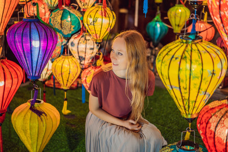 Beautiful Caucasian tourist woman in Tet holidays. Vietnam Chinese Lunar New Year in springtimeの写真素材