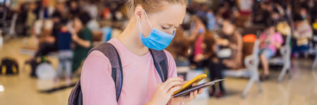 Woman traveler with medical face mask to protection the coronavirus in airport BANNER, LONG FORMAT