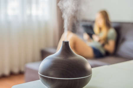 Aromatherapy Concept. Wooden Electric Ultrasonic Essential Oil Aroma Diffuser and Humidifier....