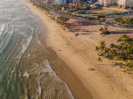Beautiful My Khe beach from drone in Da Nang, Vietnam, street and buildings near the Central beach...