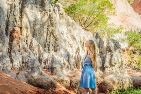 Woman tourist on the Fairy stream among the red dunes, Muine, Vietnam. Vietnam opens borders after quarantineの写真素材