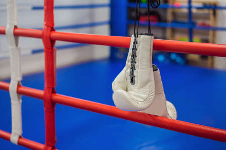 boxing equipment on the ropes of a boxing ring