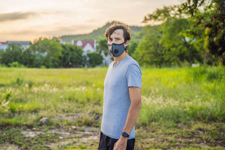 Runner wearing medical mask, pandemic. Sport, Active life in quarantine surgical sterilizing face mask protection.