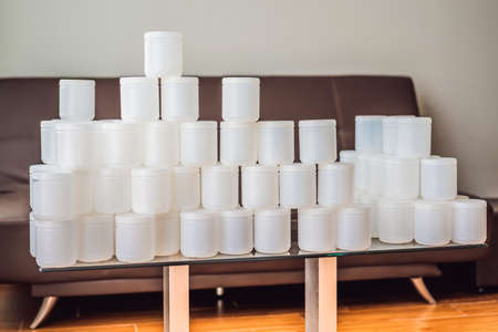 A huge amount of plastic food jars. Excessive consumption of plastic. Reduce, reuse, recycle