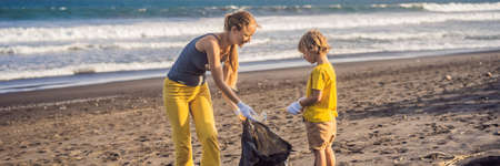 Mother and son are cleaning up the beach. Natural education of children BANNER, LONG FORMATの写真素材