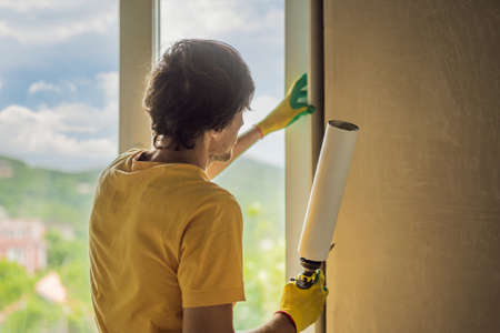 Builder or handyman is engaged in the repair or installation of windowsの写真素材