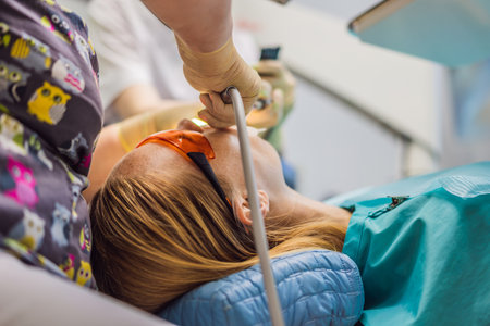 Woman having teeth examined at dentists. Dental treatment in dentistry. Appointment at the dentist....