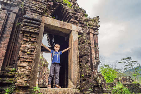 Boy tourist in Temple ruin of the My Son complex, Vietnam. Vietnam opens to tourists again after quarantineの写真素材