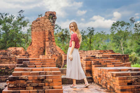 Woman tourist in Temple ruin of the My Son complex, Vietnam. Vietnam opens to tourists again after quarantineの写真素材